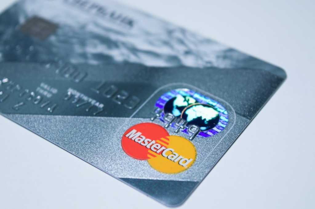 master-card-debit-card-210742 Detail shot of a MasterCard credit card, showing the chip and logo.